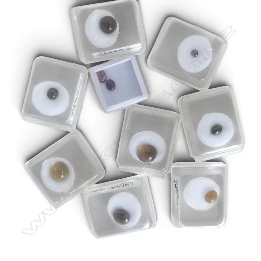NINE BOXED CABOCHON GEMSTONES From the estate of Simon Misdale. Image 1++