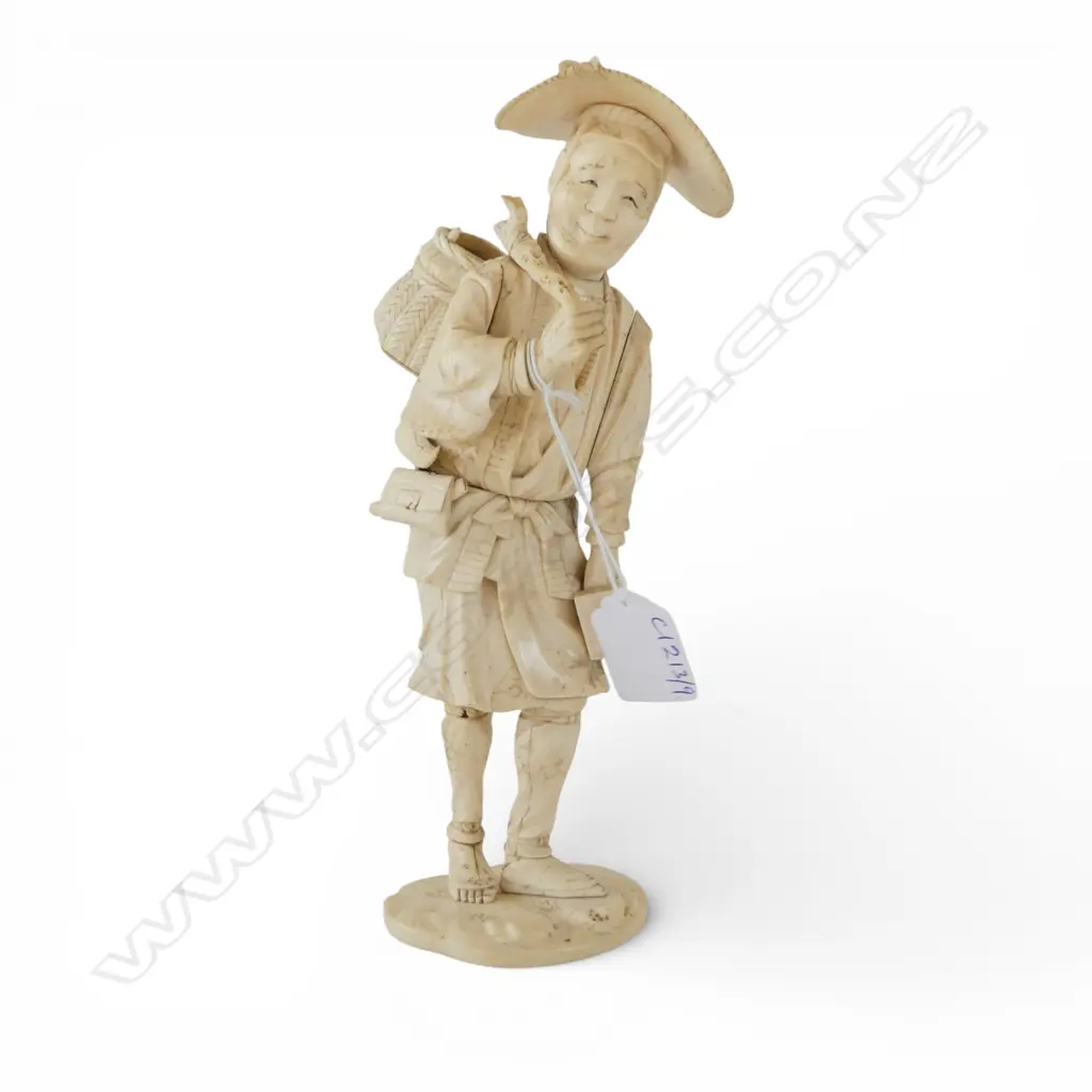 JAPANESE IVORY FIGURE; MAN CARRYING SACK OVER SHOULDER H.225mm SIGNED TO BASE Image 1++