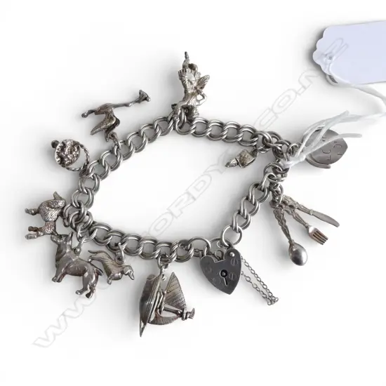 SILVER CHARM BRACELET poodle + corgi + sailboat + Scottish dancer + stork flying with baby etc 36gms