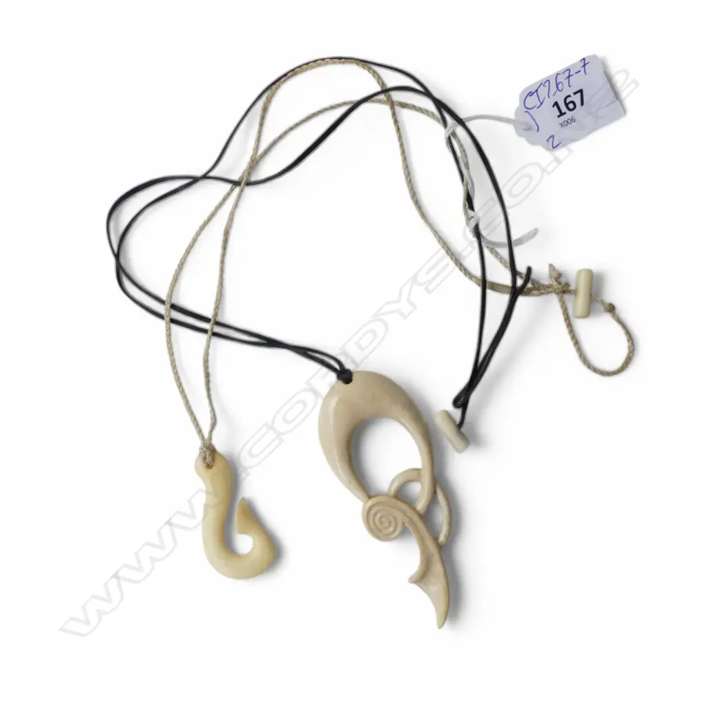 2 BONE PENDANTS; HEI MATUA & OTHER FORM  Image 1++