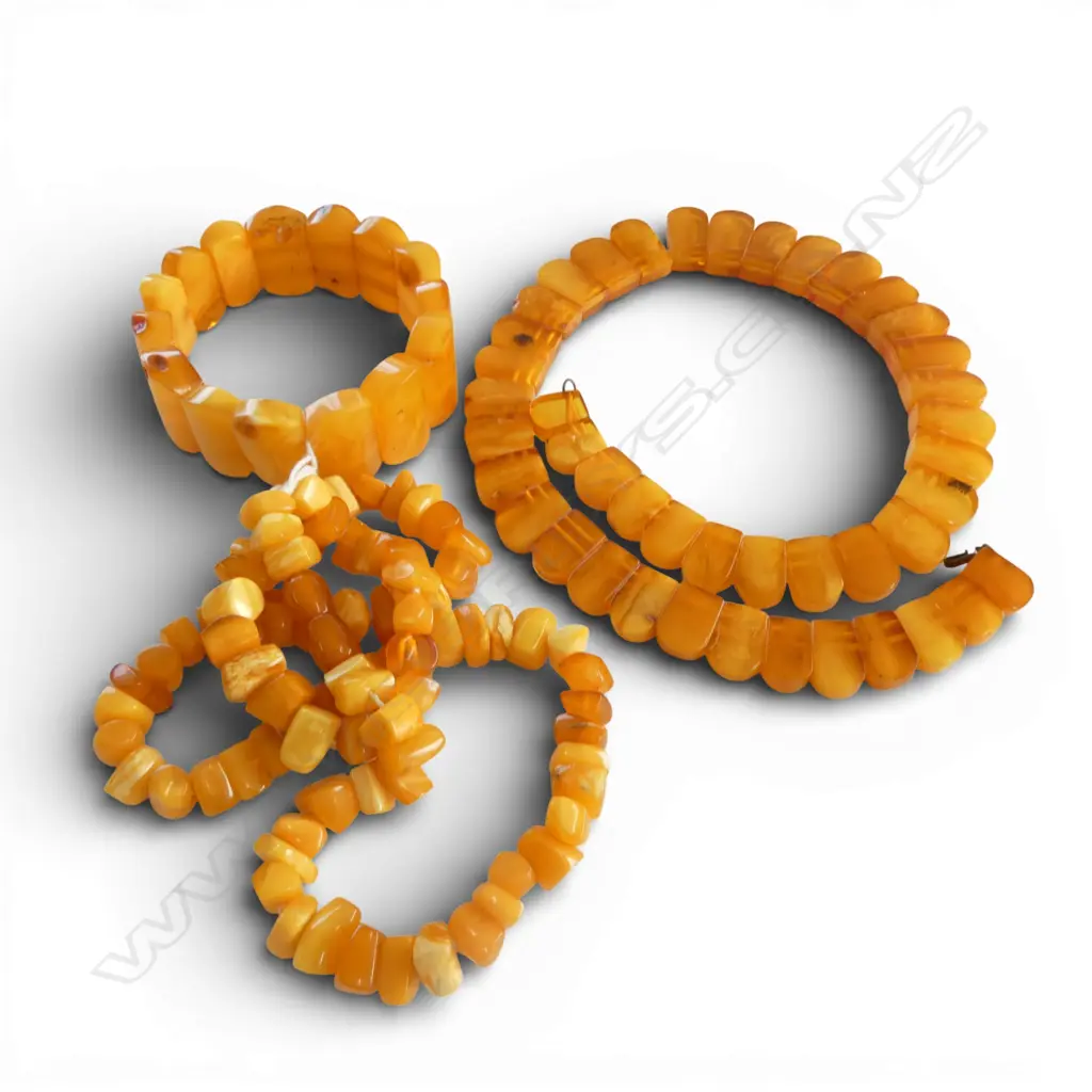 TWO AMBER NECKLACES & A BRACELET From the estate of jeweller Simon Misdale` Image 1++