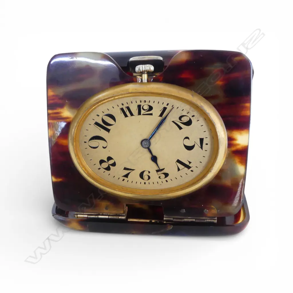 SWISS MADE TRAVELLING CLOCK running. Gilt cased in early tortoiseshell plastic outer case Image 1++