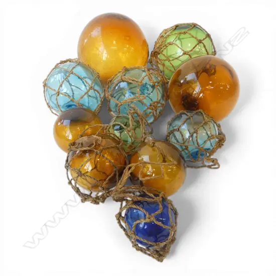 11 JAPANESE GLASS FLOATS OF VARIOUS SIZES some with netting 
