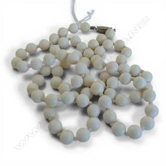 STRING OF HAND NOTTED IVORY BEADS