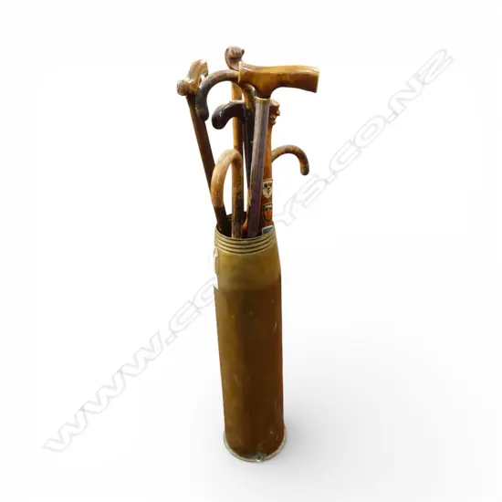 LARGE BRASS MILITARY SHELL CASE H.645mm w 8 walking sticks 