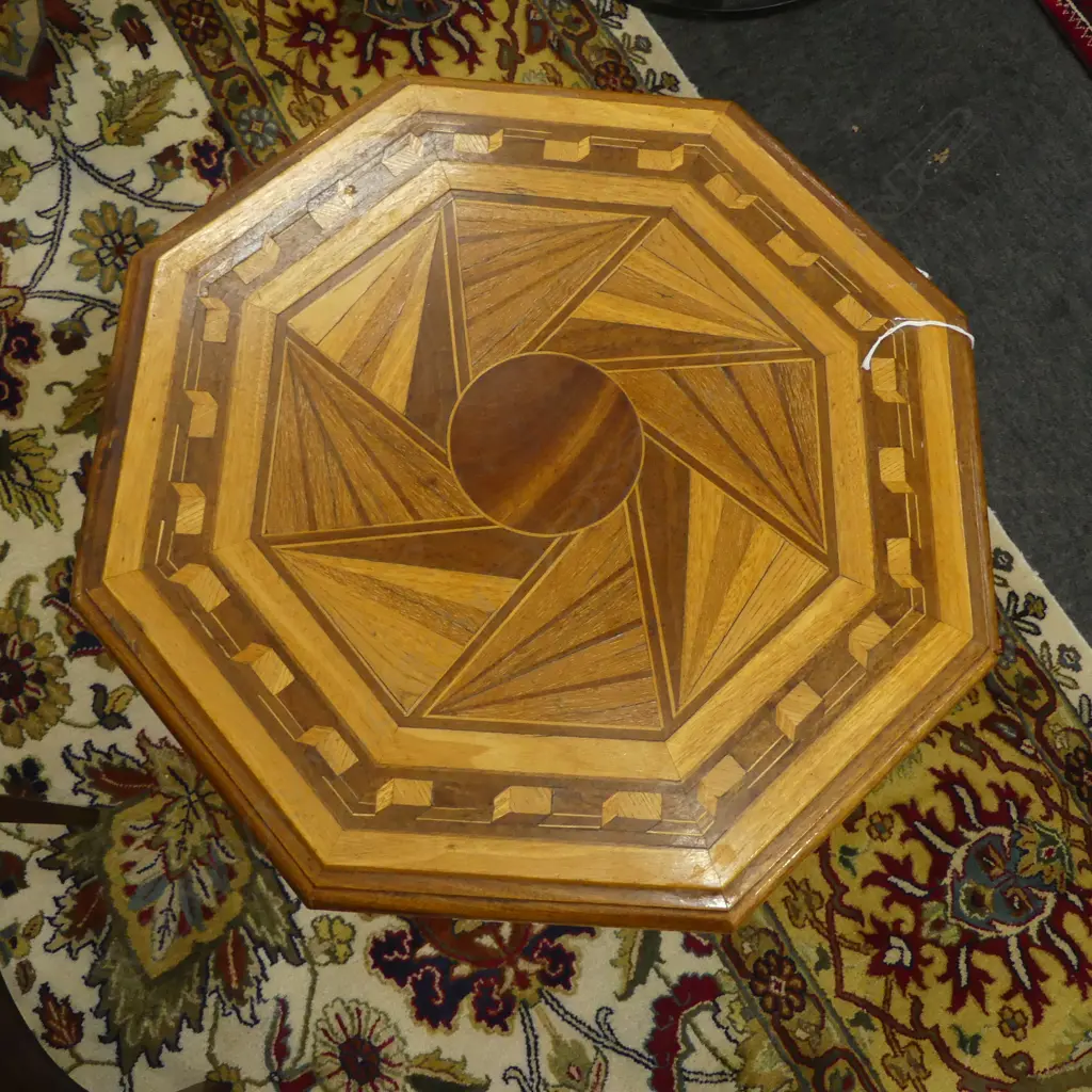 NZ TIMBERS OLD OCTAGONAL SHAPED OCCASIONAL TABLE ON SINGLE PEDESTAL, TOP WITH iNLAYS OF REWAREWA KOHEKOHE ETC THE BASE O Image 1++