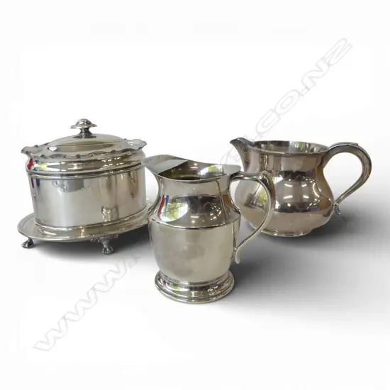 2 SILVER PLATE JUGS + CADDY & DOILIES