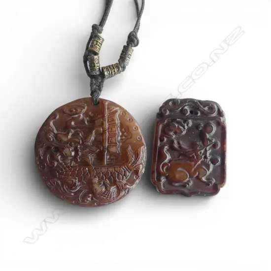 TWO CHINESE CARVED STONE PENDANTS WITH DRAGON DECORATION 50mm (D)