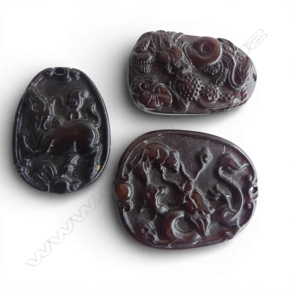 THREE CHINESE CARVED STONE PENDANTS Image 1++