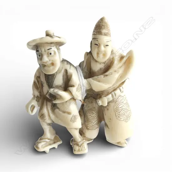 JAPANESE CARVED IVORY NETSUKE two figures H.60mm
