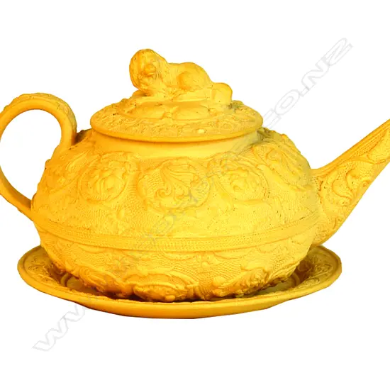 A Wedgwood creamware teapot and saucer