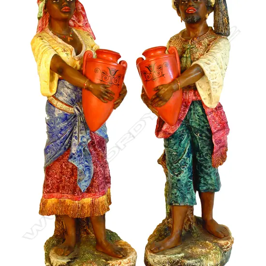 A pair of early 1900s china figures in the Goldscheider manner
