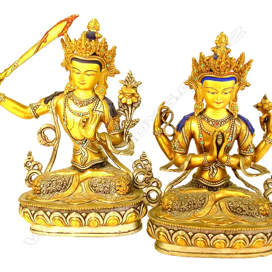 A pair of Nepalese gilt bronze statuettes