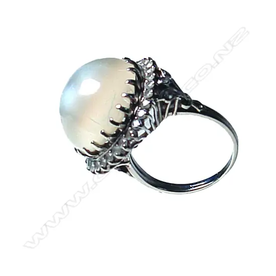 A vintage platinum and moonstone lady's dress ring