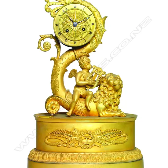 A 19thC French Empire period sculptural ormolu bronze mantel clock