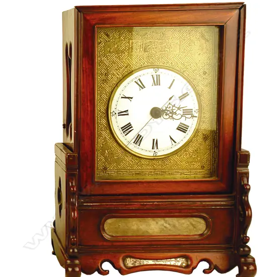A Chinese rosewood cased mantel clock