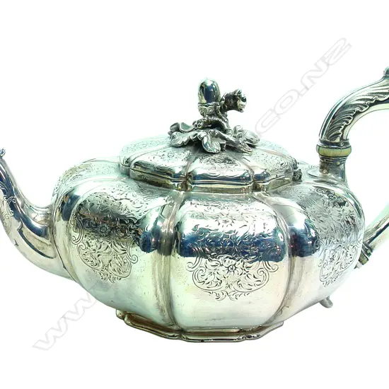 A rare (Paul) Storr & Mortimer fine quality late William IV Storr silver teapot of octagonal lobed shape with flat chased decoration of leaves