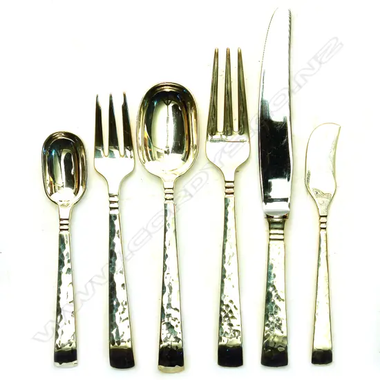 A silver eight place cutlery set