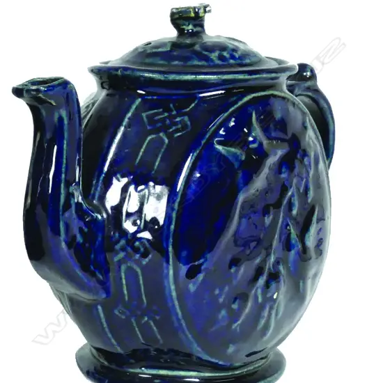 A late 19thC N.Z. Luke Adams 'Kowhai' blue glazed teapot