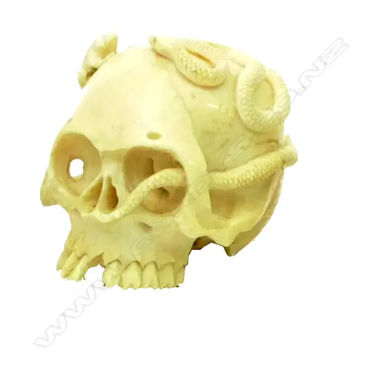 An old carved ivory skull ornament