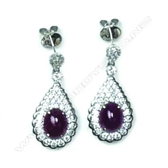 A pair of modern 18ct. white gold diamond and ruby lady's drop earrings
