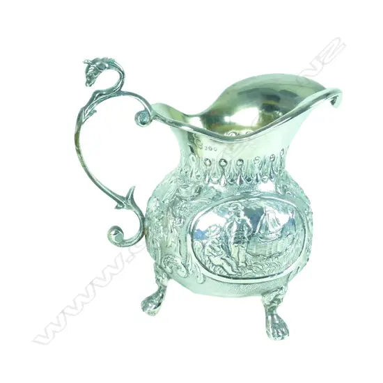 A Dutch silver baluster tripod cream jug