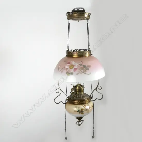 A Victorian glass and brass hanging Miller kerosene lamp
