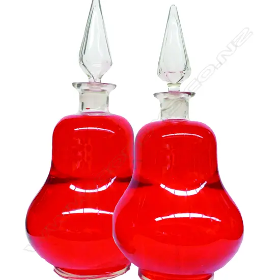 A pair of Victorian large clear glass pharmaceutical/chemist's display bottles