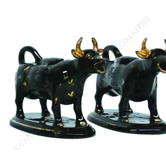 A pair of 19thC Jackfield cow creamers