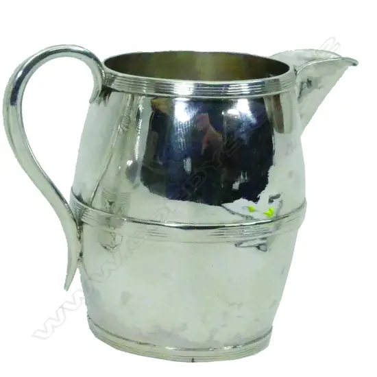 A late Georgian silver barrel shaped jug