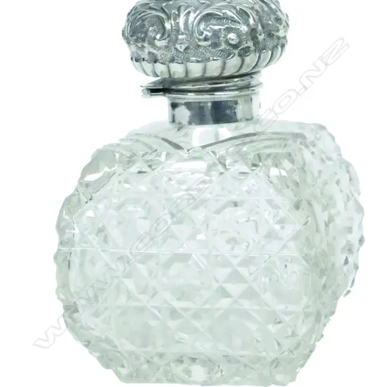 An Edwardian silver and crystal scent bottle