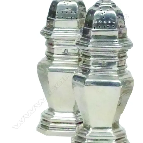 A pair of Victorian silver pepperettes