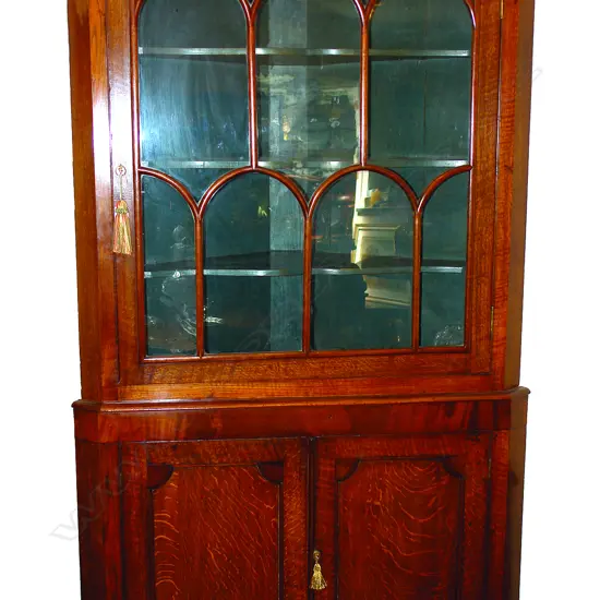A Geo.III oak and mahogany standing corner cabinet