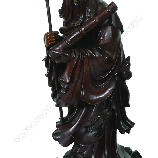 A Chinese carved rosewood figure of a scholar