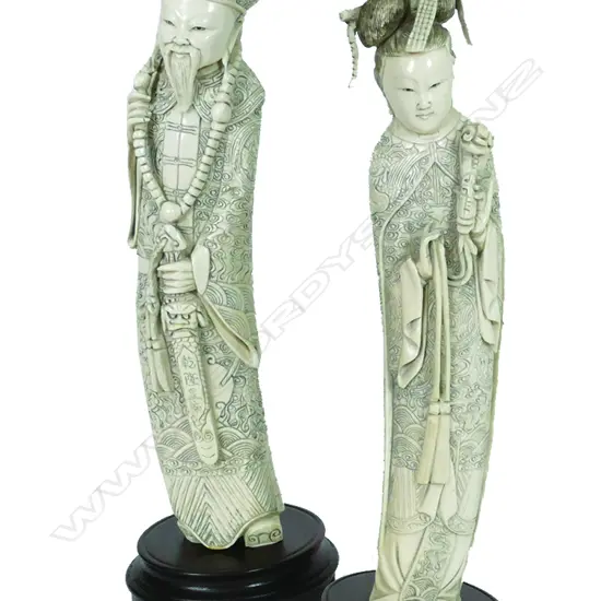A pair of old Chinese carved ivory Emperor and Empress figures
