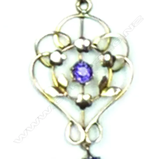 An Edwardian 9ct. rose gold and amethyst pendant