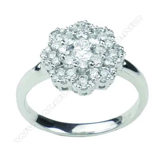 A modern lady's 18ct. white gold and diamond cluster ring