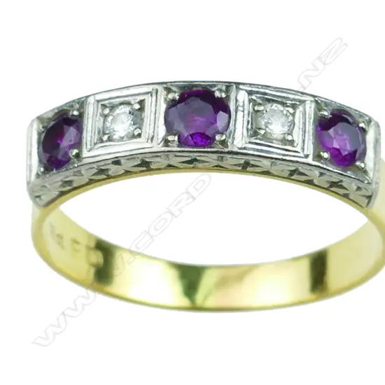 A lady's estate 18ct. yellow gold ruby and diamond ring