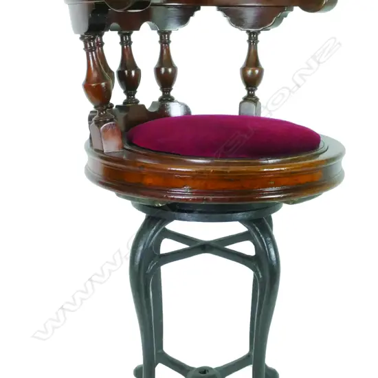 A late 19thC mahogany and cast iron ship's lounge chair