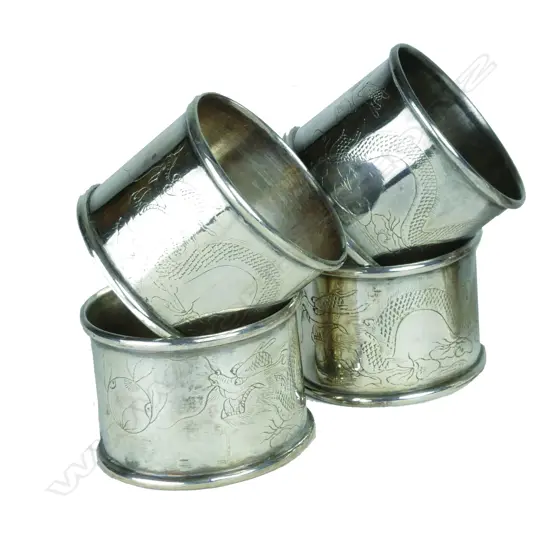 A set of four matching Chinese silver napkin rings