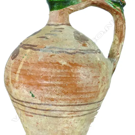 A large archaic earthenware pottery jug