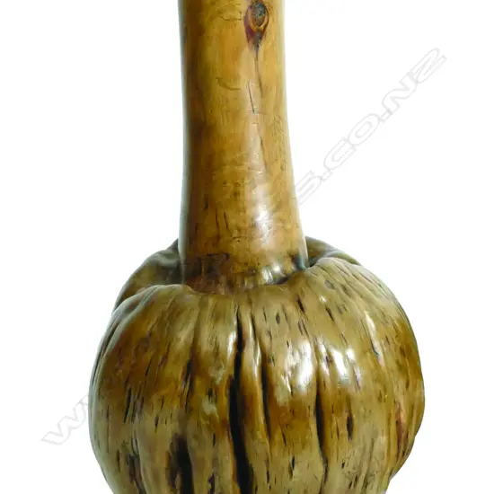 A timber vase made from the naturally swollen bol or burr of a small tree