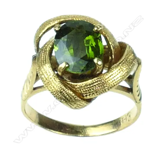 A retro 18ct gold and green sapphire ring