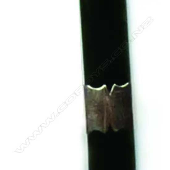 An early 20thC dark greenstone kapeu pendant