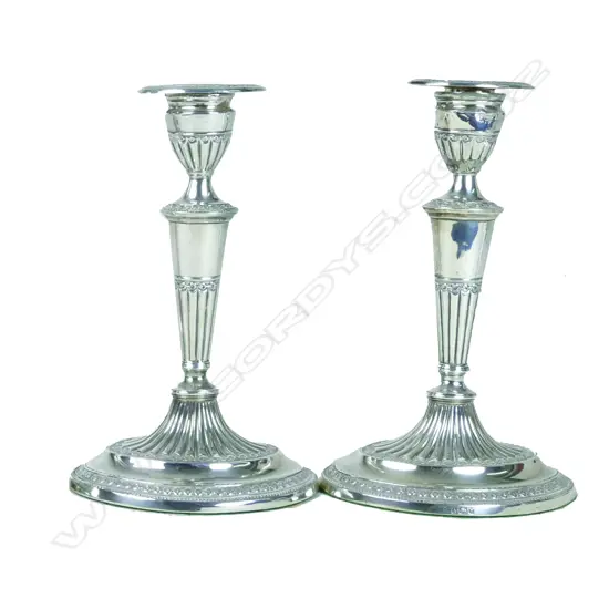 A pair of Victorian silver candlesticks
