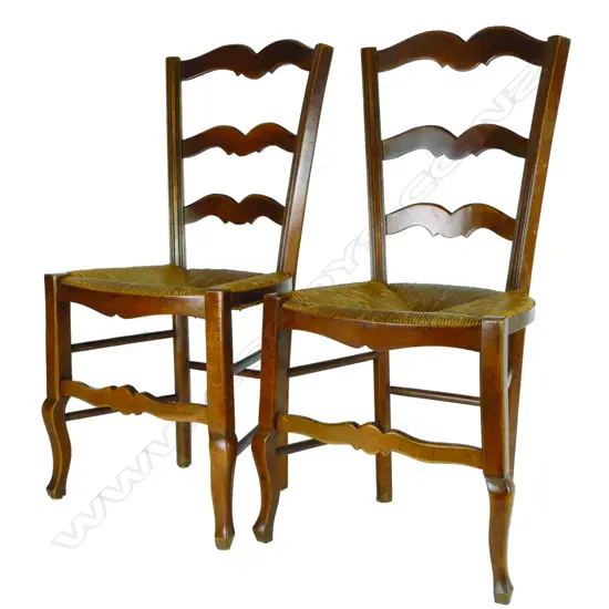 Eight rush-seated oak ladderback chairs