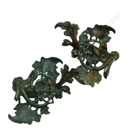 A pair of Victorian bronze Art Nouveau curtain tie-backs