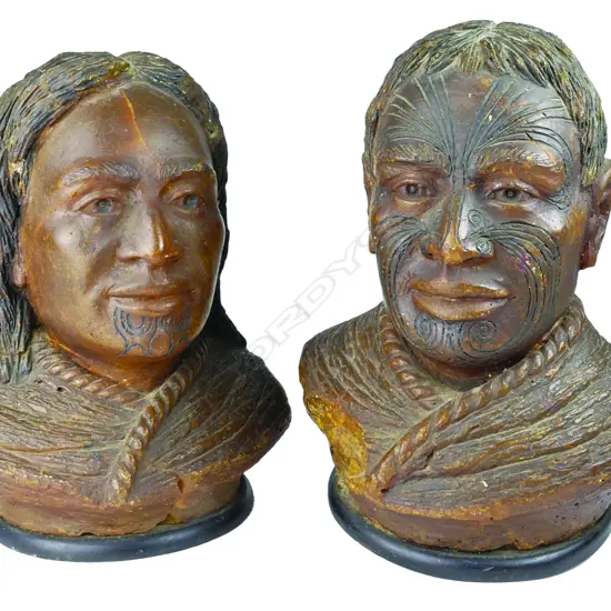 A pair of late 19thC large carved kauri gum busts of a Maori chief and chieftainess