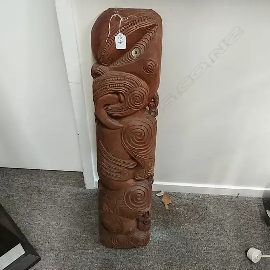 A carved Maori figurative panel