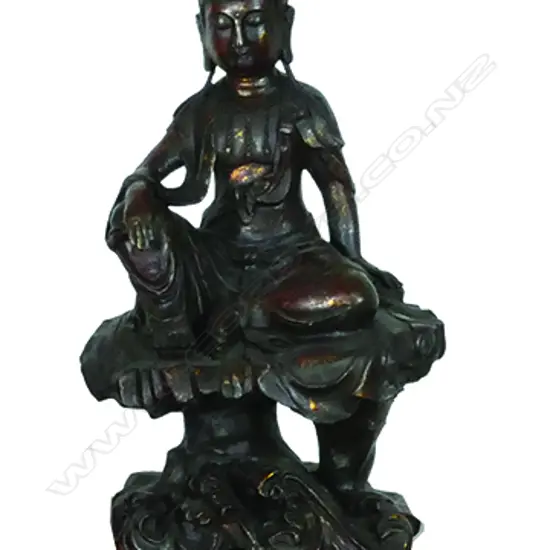 A cast metal statuette of Kuanyin